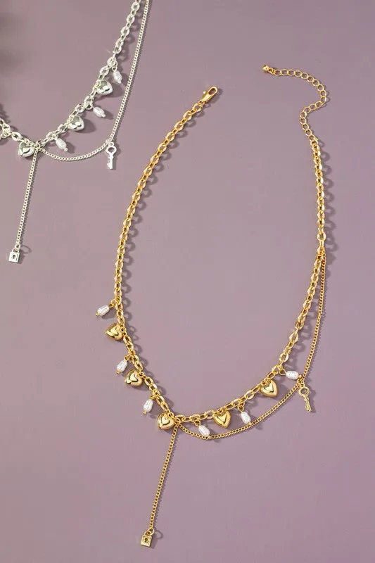 Asymmetric necklace with puffy heart drops