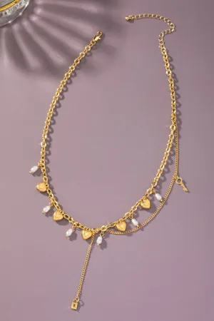 Asymmetric necklace with puffy heart drops