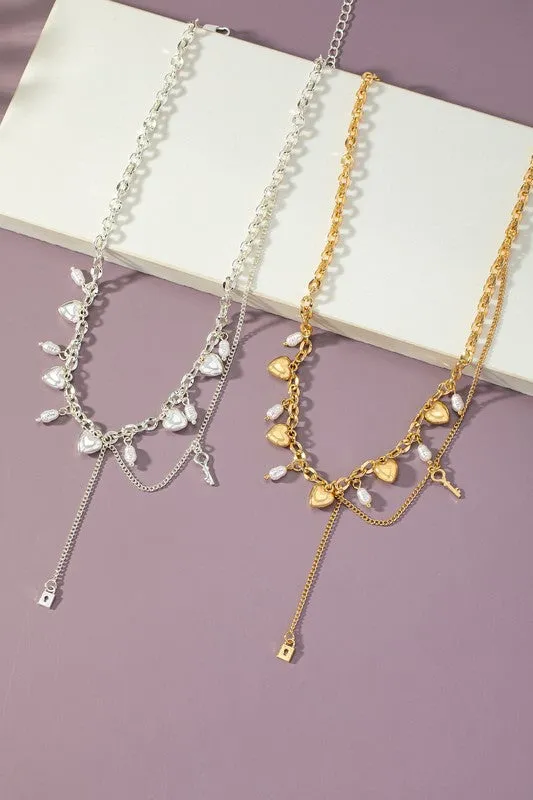Asymmetric necklace with puffy heart drops