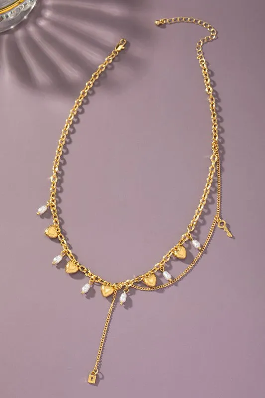 Asymmetric necklace with puffy heart drops