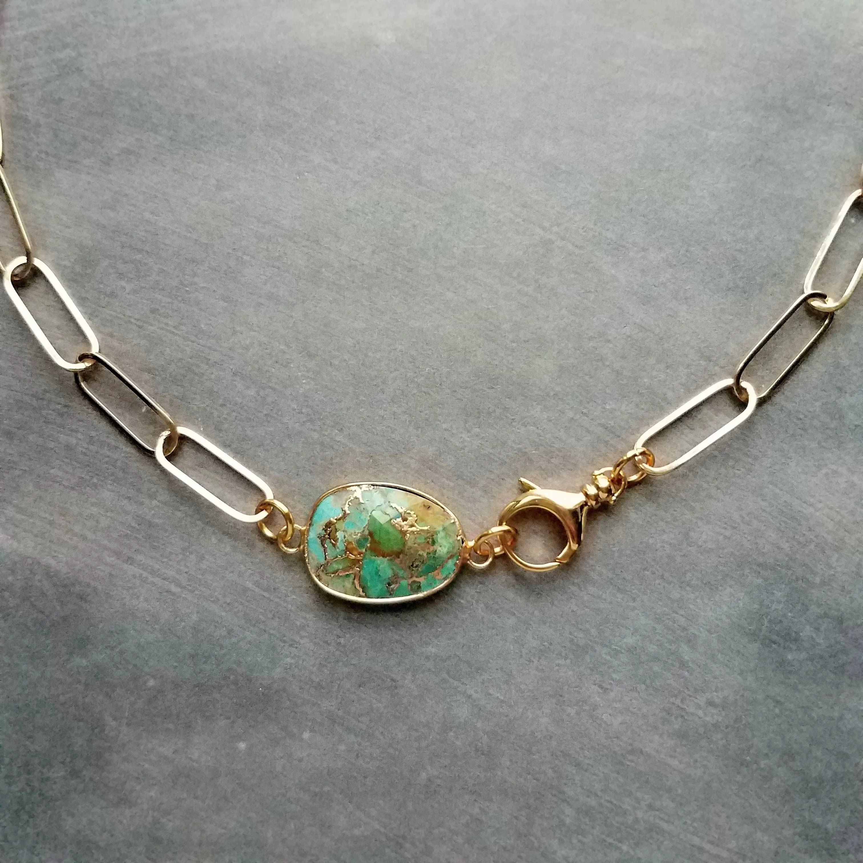 Copper Turquoise Necklace on gold paperclip style chain, front horseshoe shackle screw clasp, facet cut stone pendant, gold brown blue green