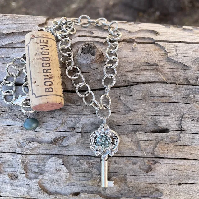 Key pendant necklace on silver plated chain
