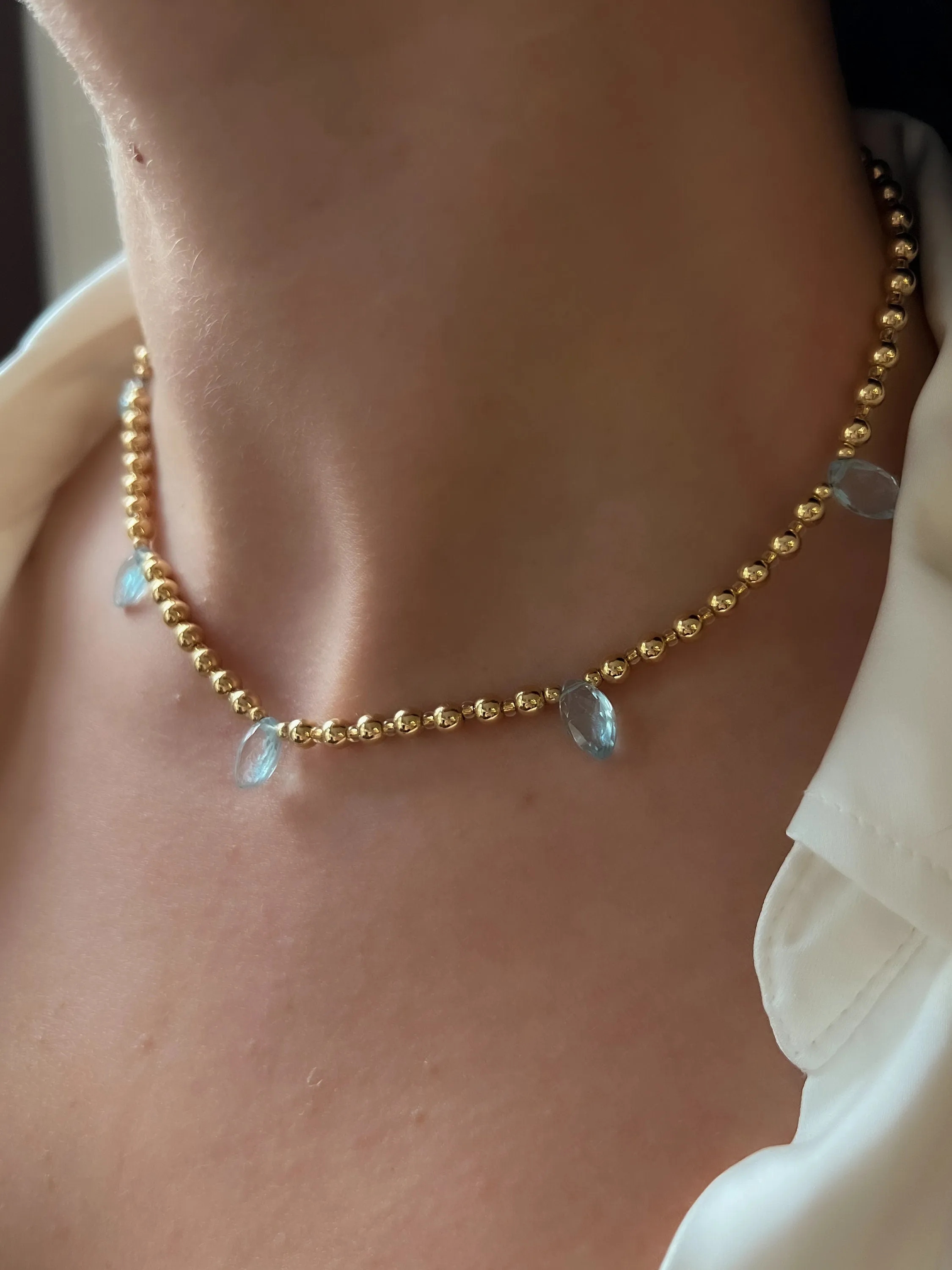 Lt Blue Topaz and Gold Bead Necklace