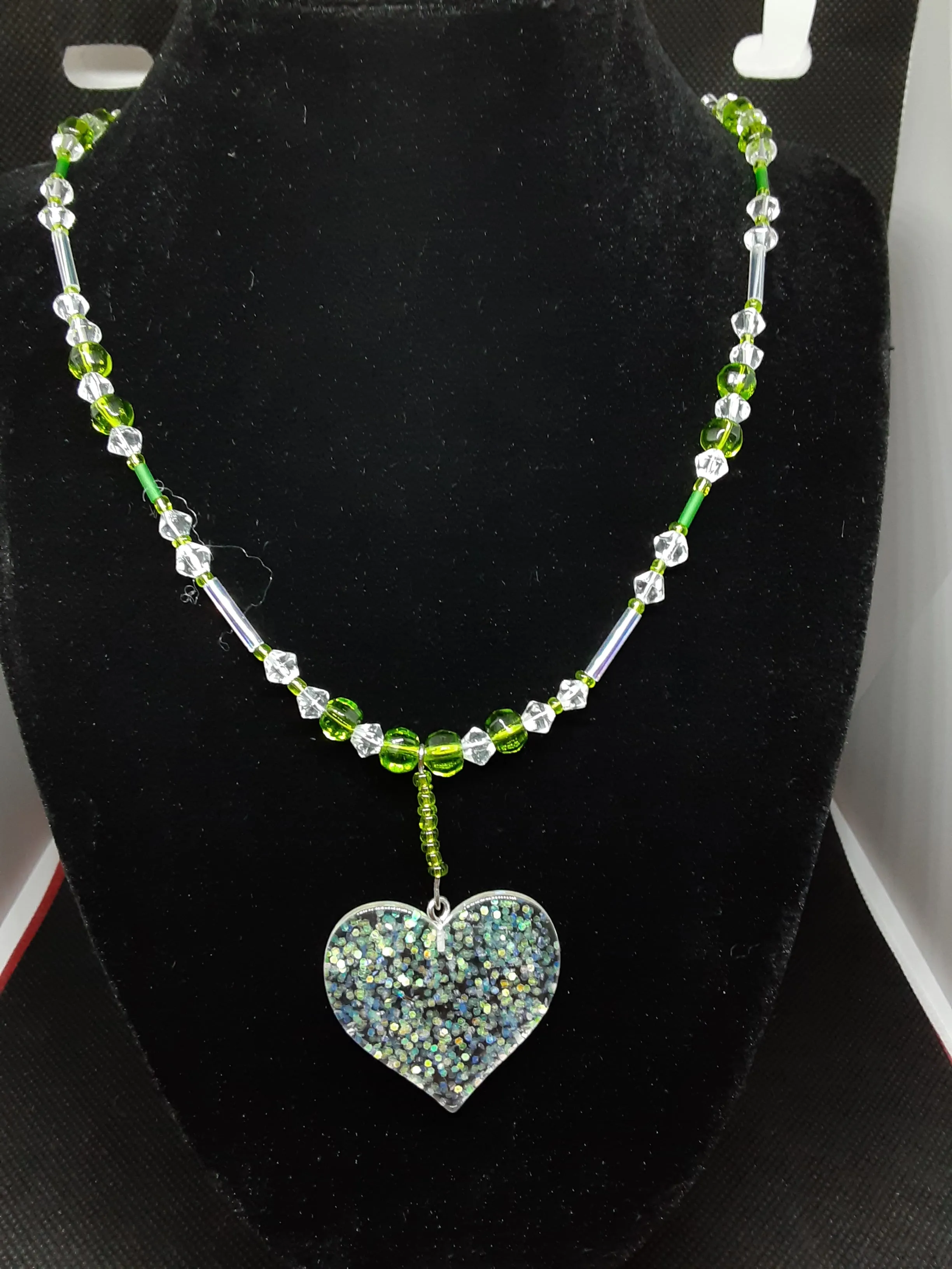 N#104 Period Crystals (Aug. Birthstones), Clear Crystals, Silver and Glitter in a Heart?