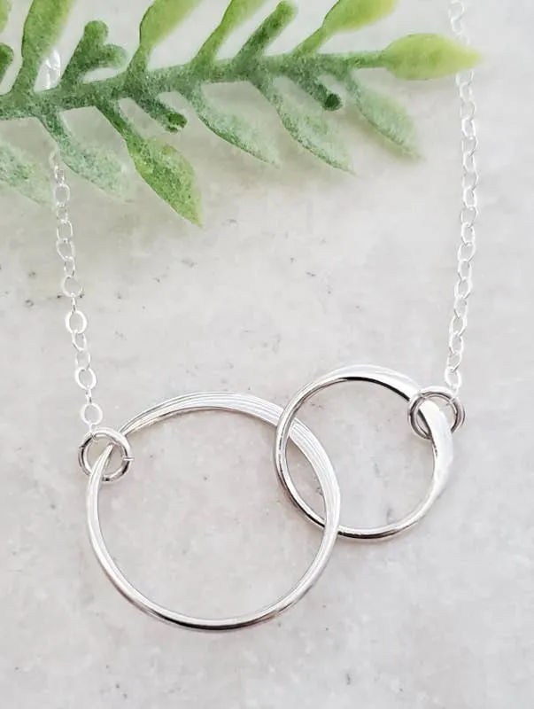 Two Intertwined Circle Sideways Necklace in Sterling Silver